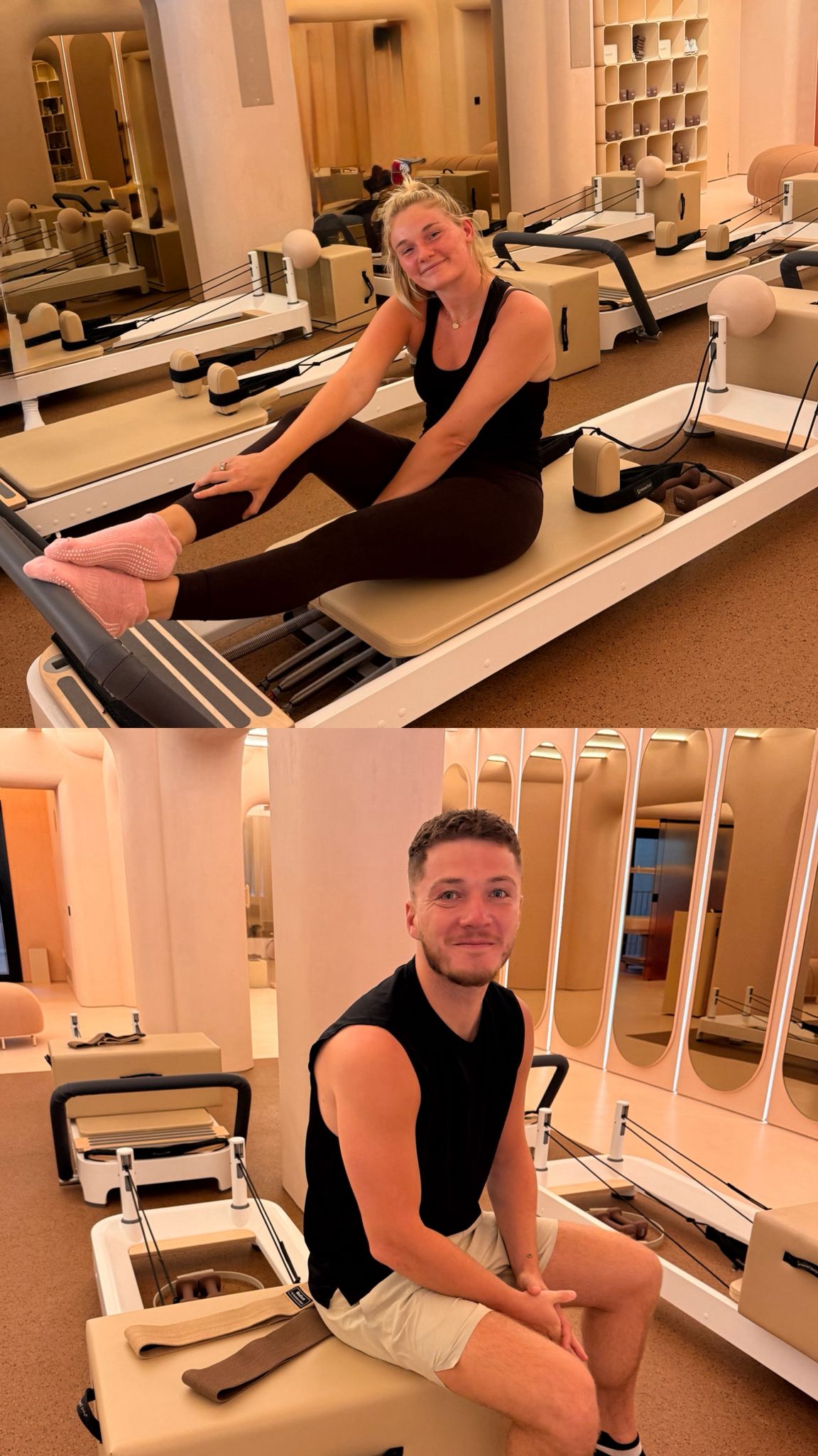 Two people sitting on Pilates reformers in a studio