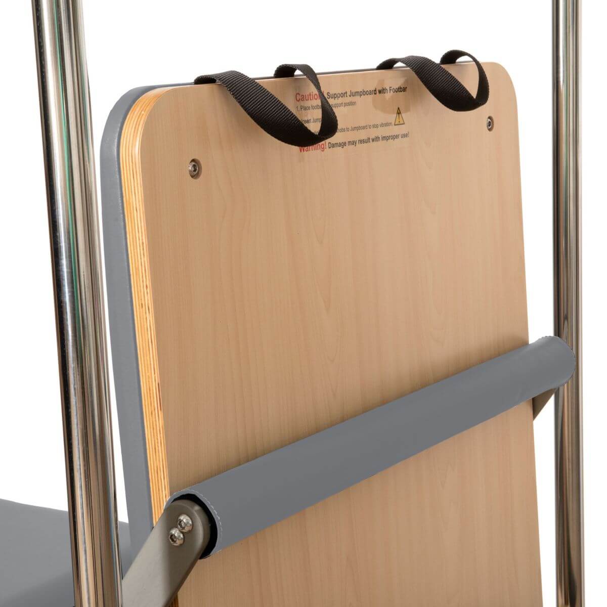 Close-up of the wooden carriage panel and padded straps on the Elina Pilates Cadillac Reformer