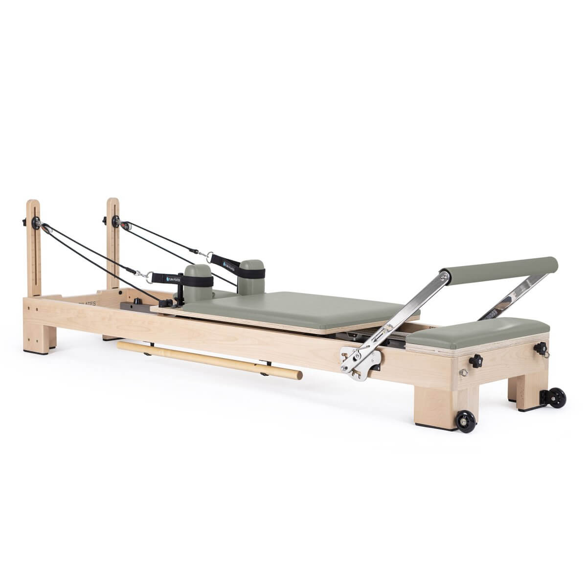 Elina Pilates Lignum Reformer in sage green upholstery, side view on a white background
