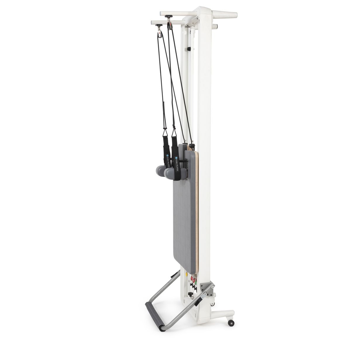 Elina Pilates Nubium Reformer in its vertical storage position showing the ropes and pulley frame