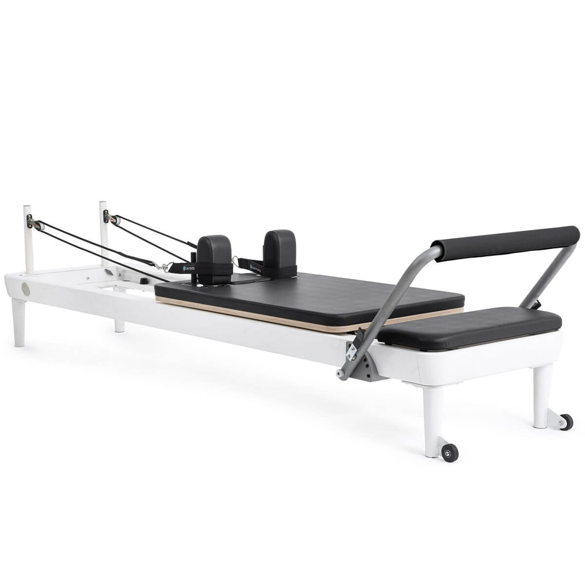 Elina Pilates Nubium Reformer with white frame and black upholstery, angled view