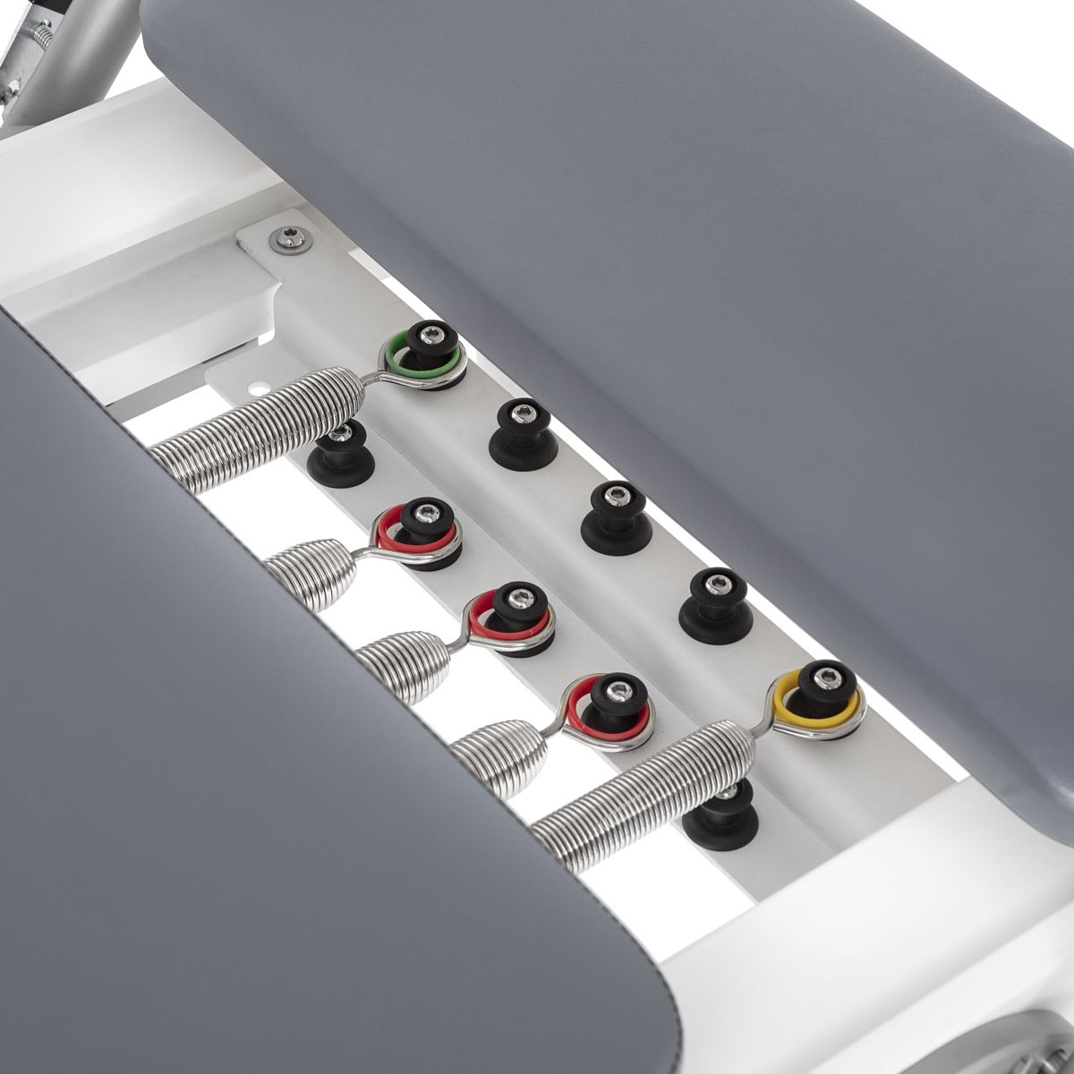 Close-up of the colour-coded spring settings on the Elina Pilates Nubium Reformer