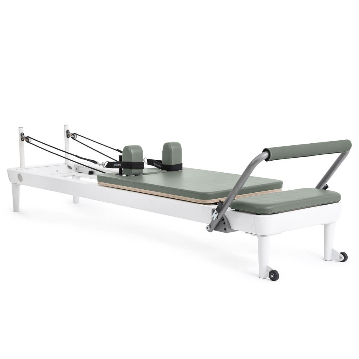 Elina Pilates Nubium Reformer with white frame and sage green upholstery, side view