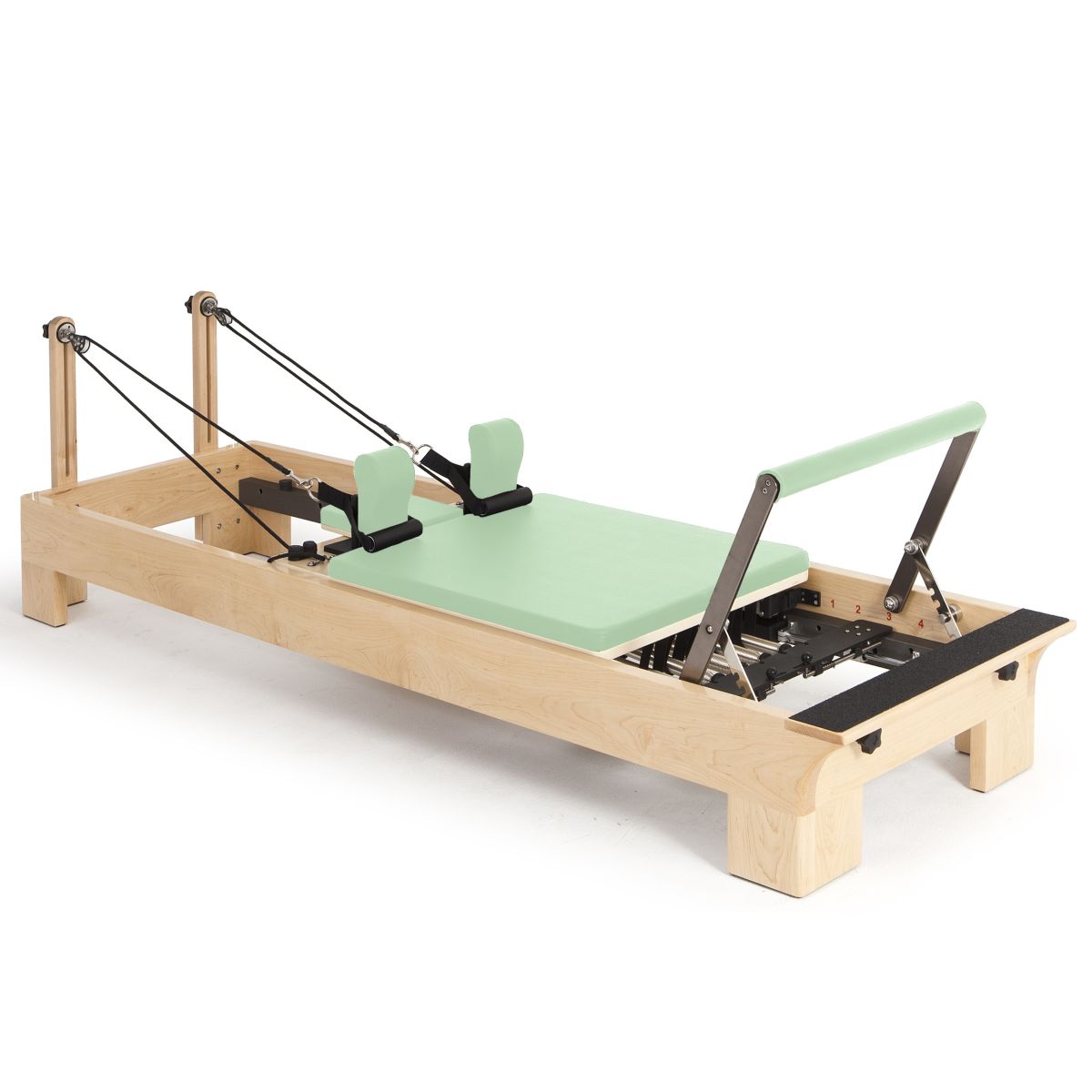 Elina Pilates Wooden Reformer with mint green upholstery, angled view on a white background