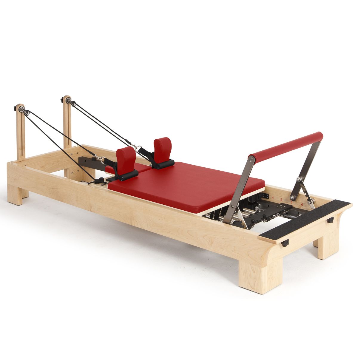 Elina Pilates Wooden Reformer with red upholstery, angled view on a white background
