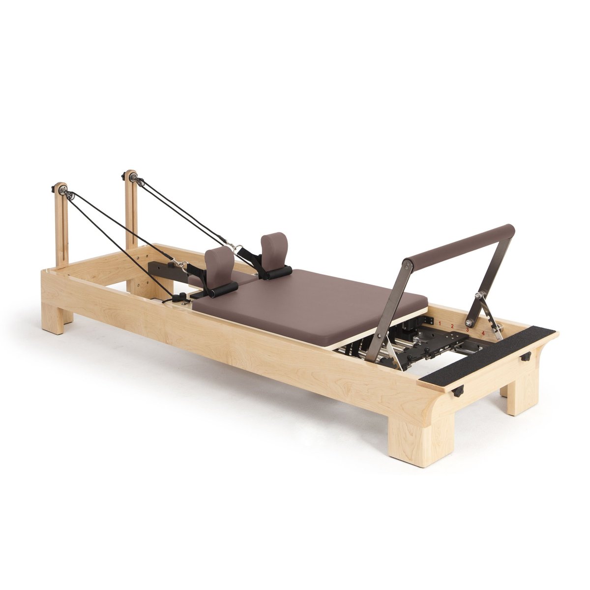 Elina Pilates Wooden Reformer with brown upholstery, angled view on a white background
